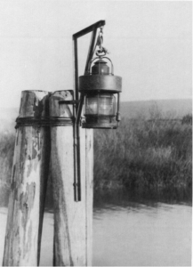 Figure 1.5 This illustration shows a similar style pile cluster light using a Lighthouse Service Post Lantern B lantern, which was used as the temporary light while the breakwater was being constructed.